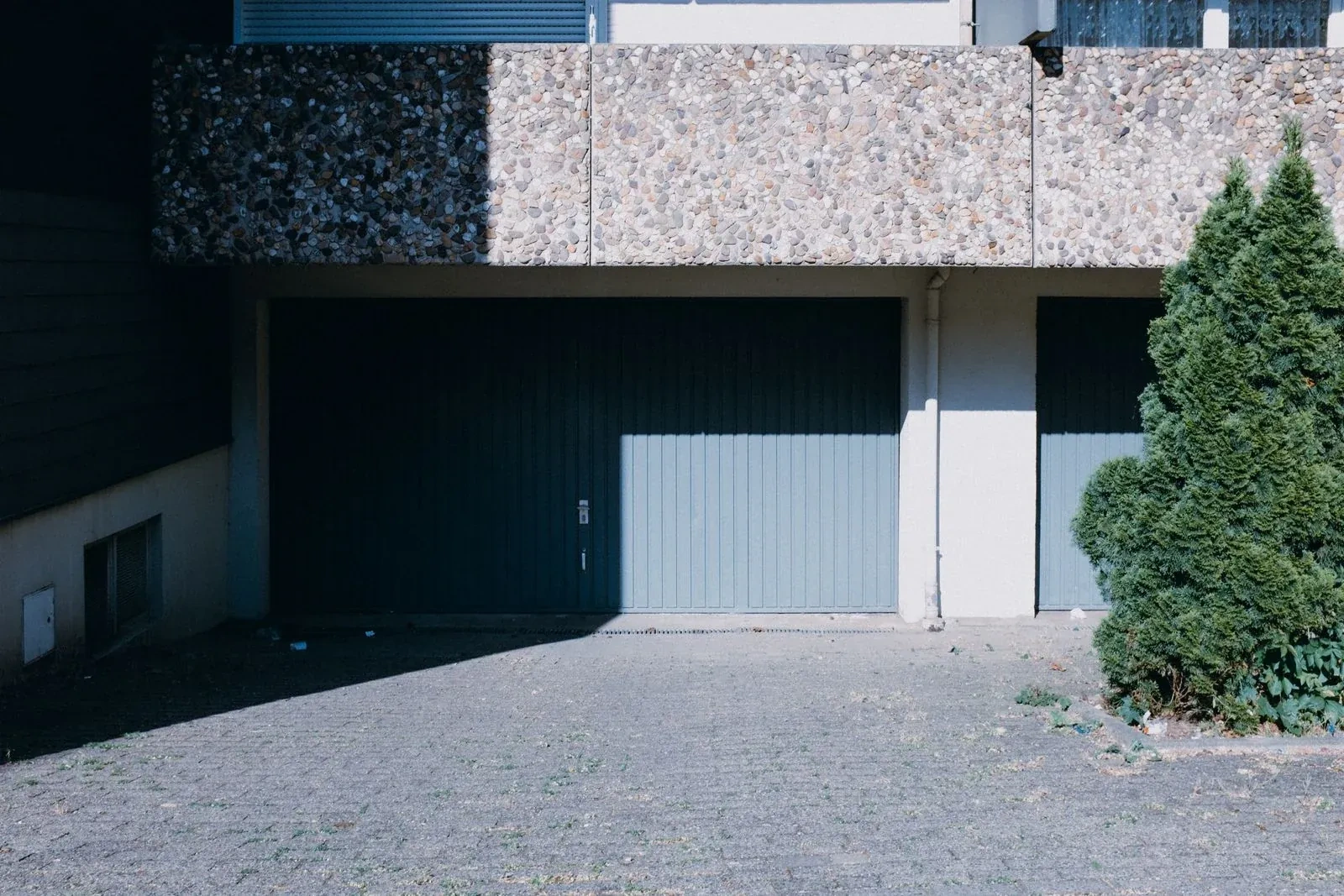 Illustrative garage doors scene; not an actual job